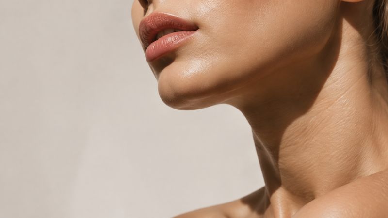 Close-up of lips and skin in soft natural light